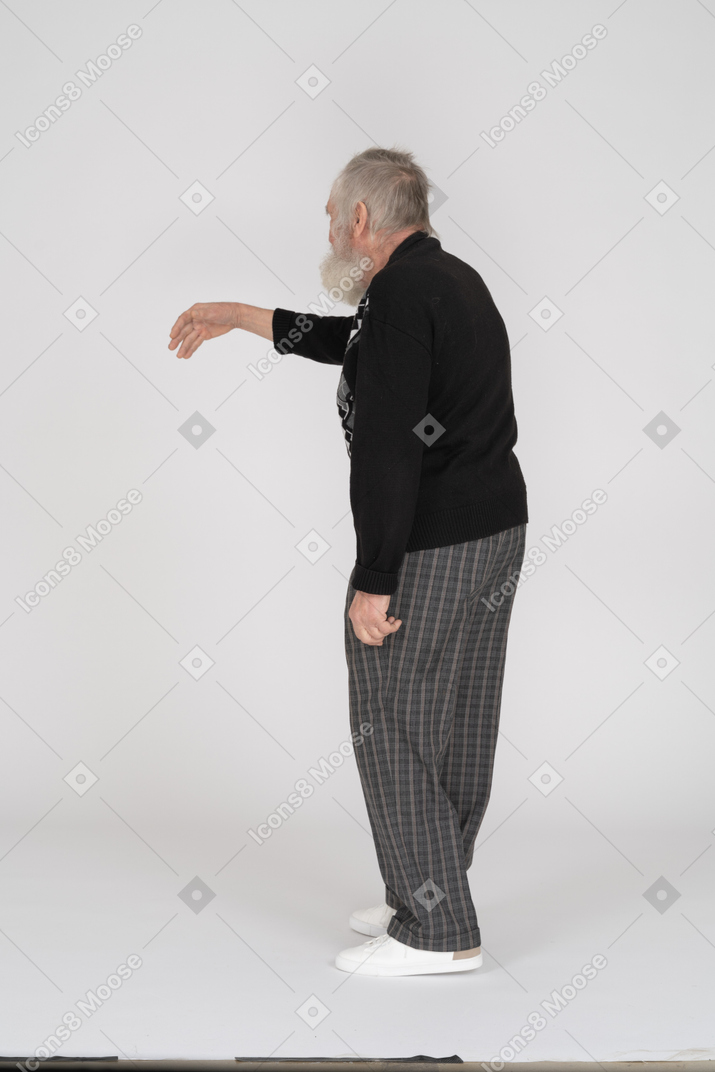 Rear view of old man gesturing