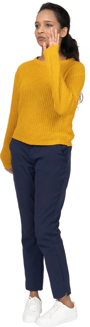 Front view of a girl in casual clothes waving