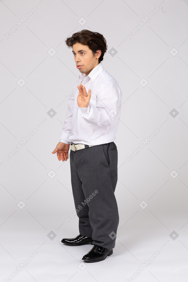 Young man in business casual clothes gesturing