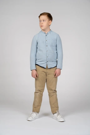 Front view of boy in casual clothes looking aside