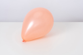 Orange balloon on a white background