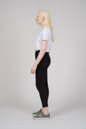 Side view of a young woman in casual clothes looking away