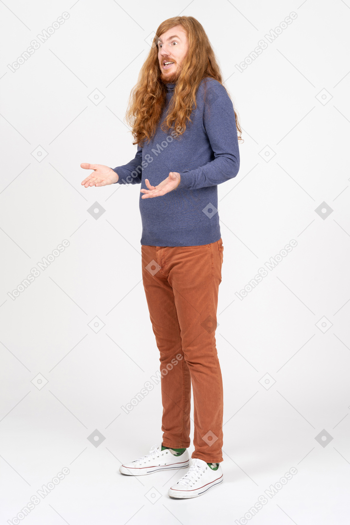 Side view of a confused young man in casual clothes