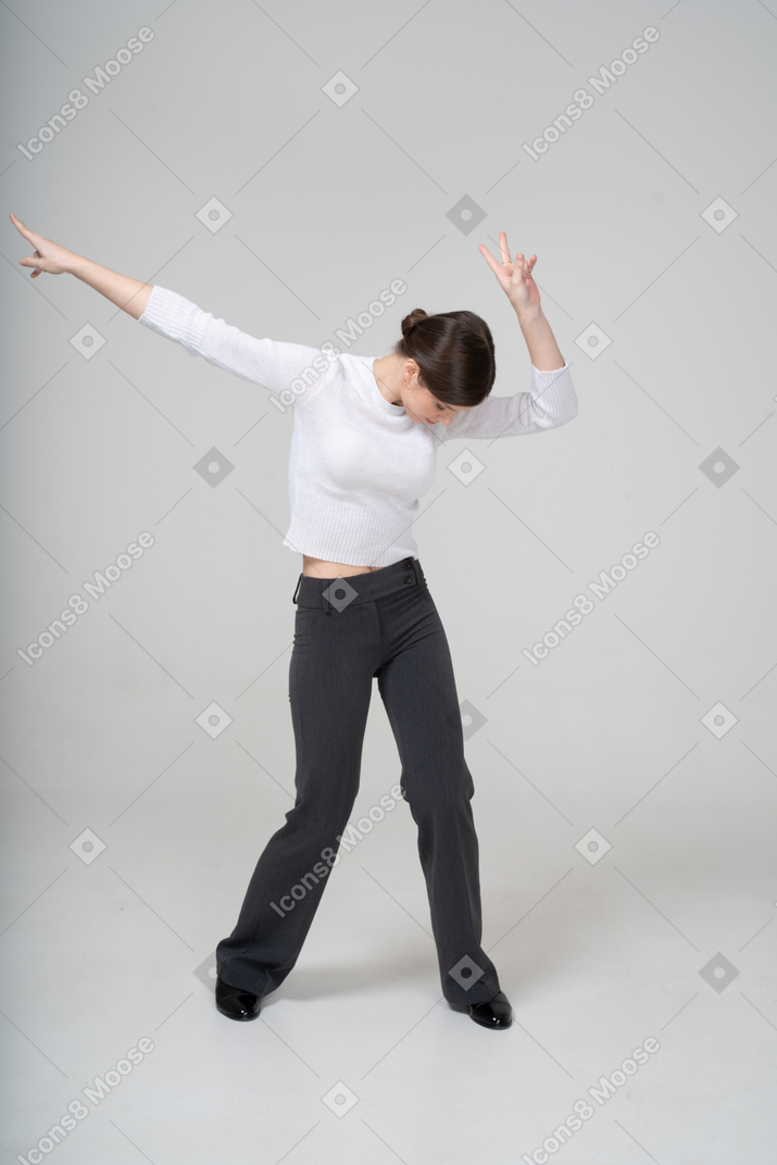Front view of a woman in suit dancing