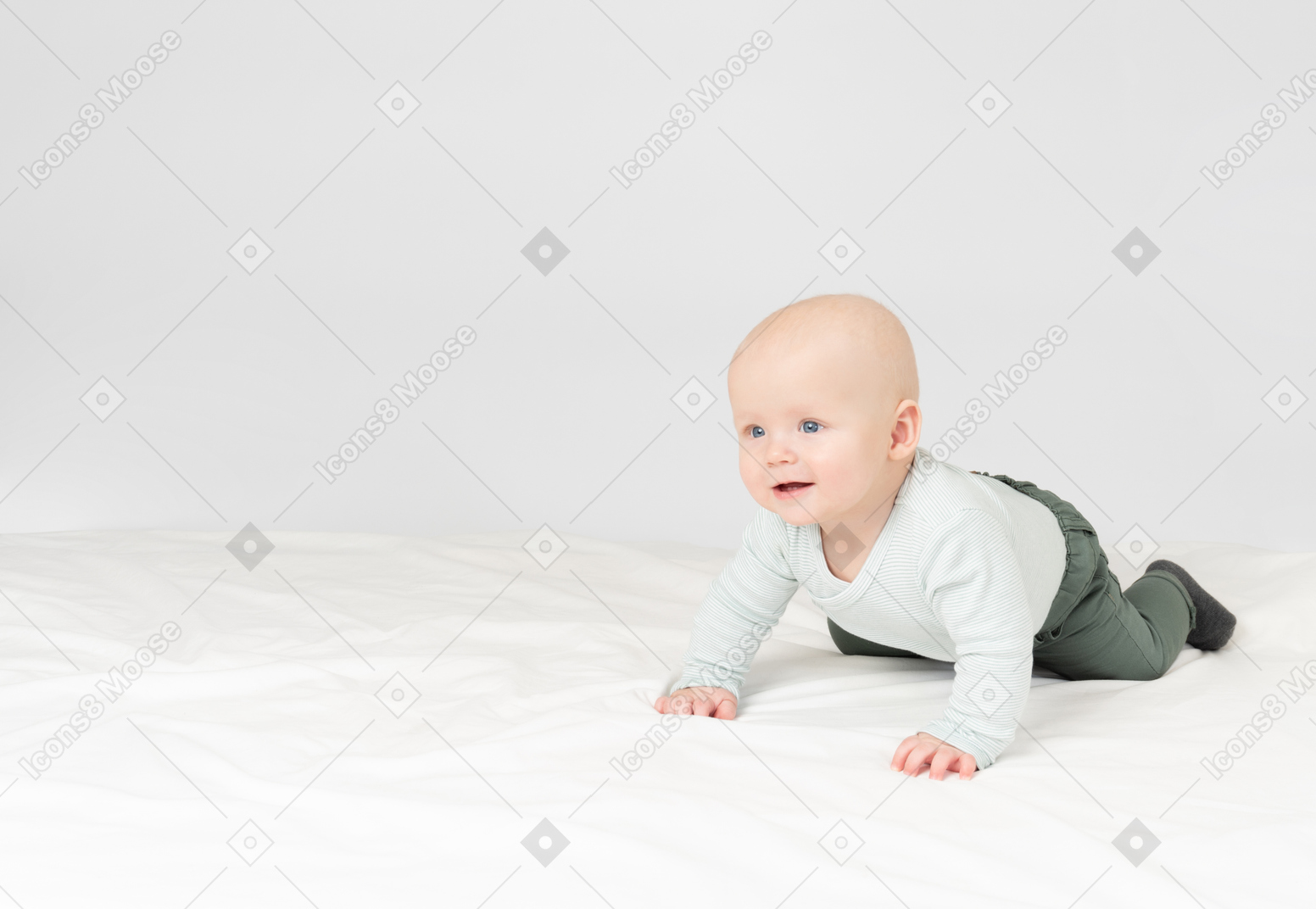 Baby boy lying on stomach