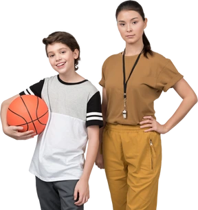 Pe teacher and her pupil holding a basketball ball