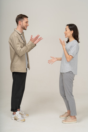 Side view of young couple speaking to each other