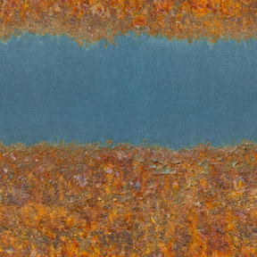 Blue metal surface covered with rust