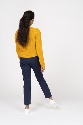 Rear view of girl in casual clothes