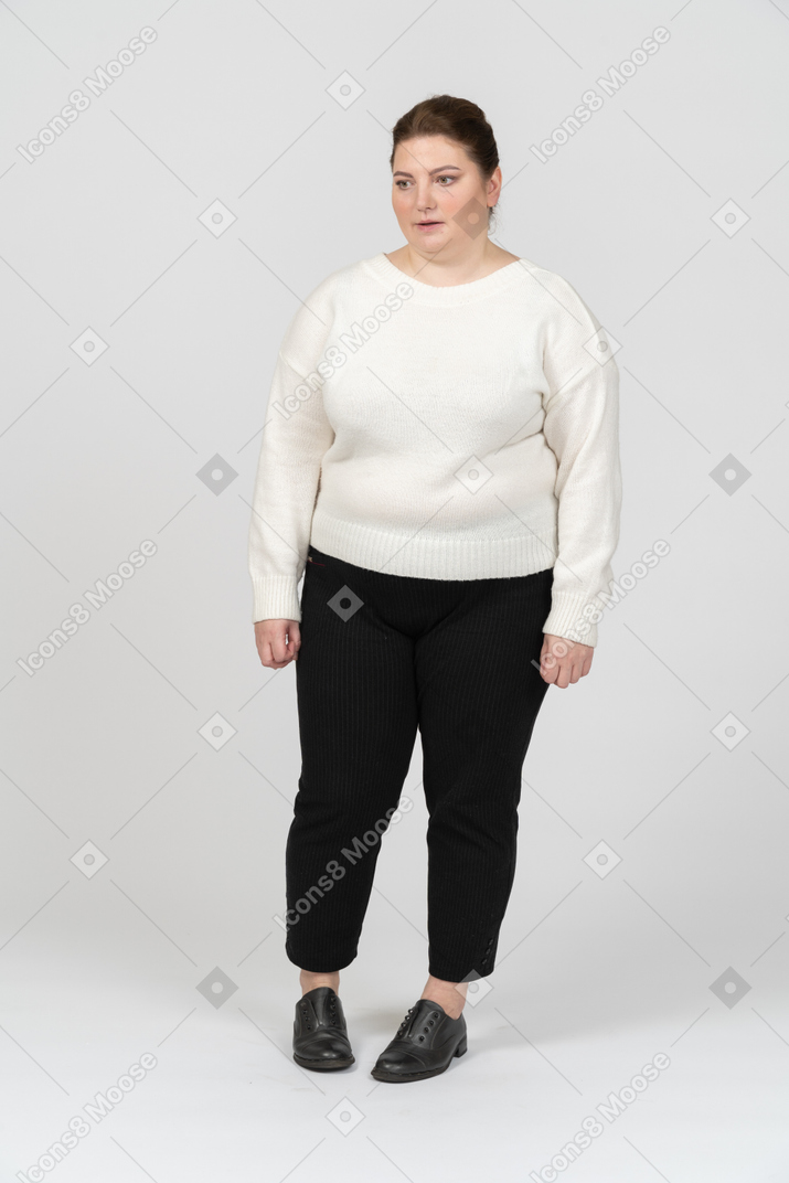 Plus size woman in white sweater