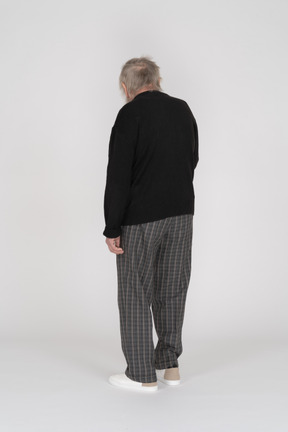 Rear view of a standing old man