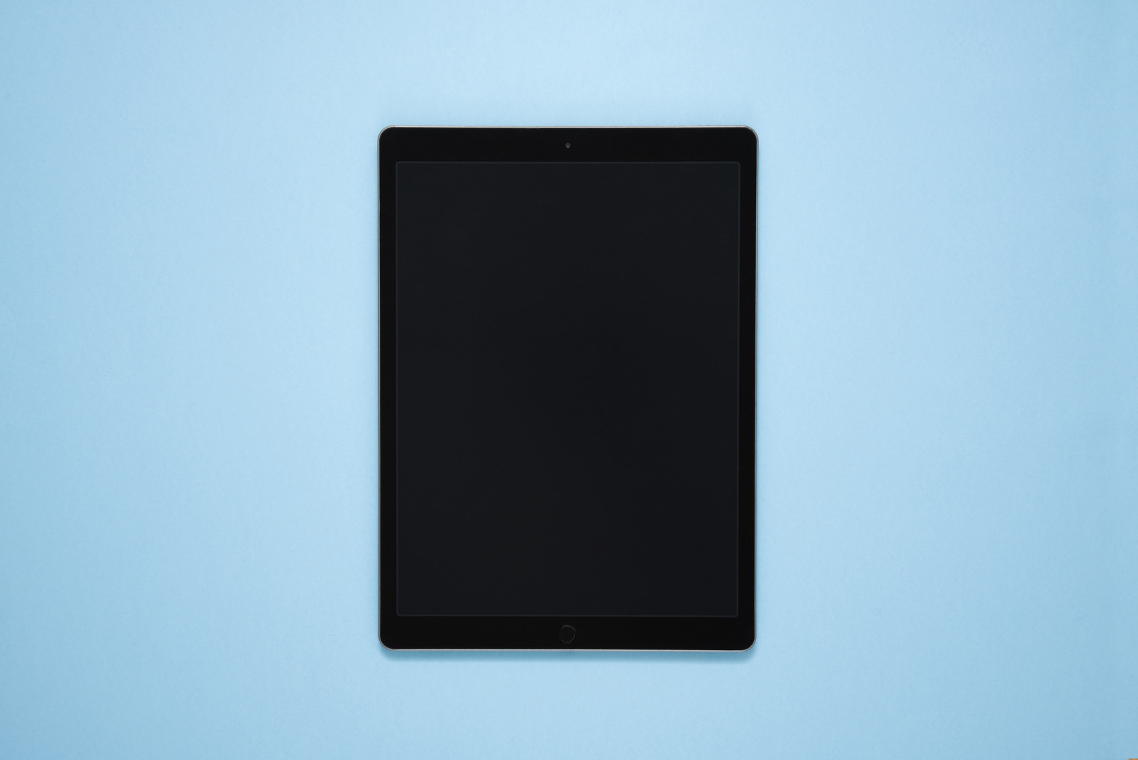 Digital tablet over blue background