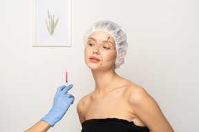 Young woman about to get botox injection