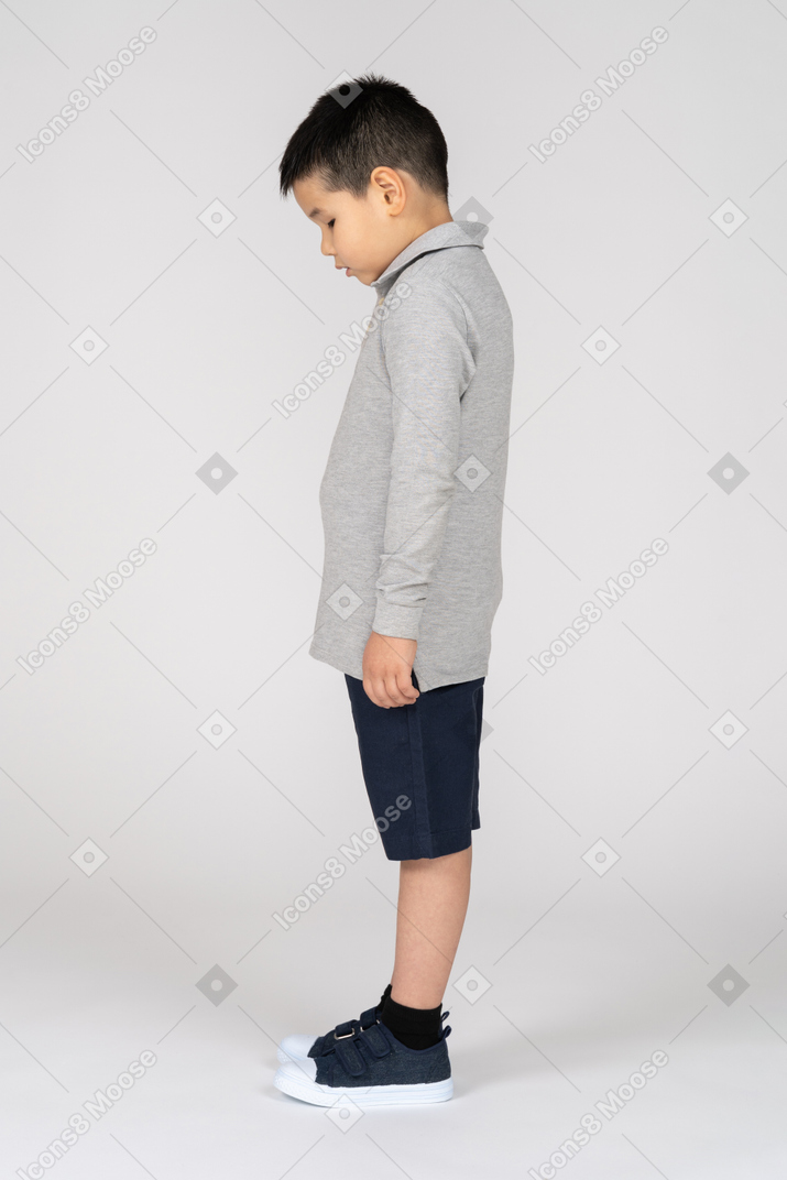 Child looking down in profile
