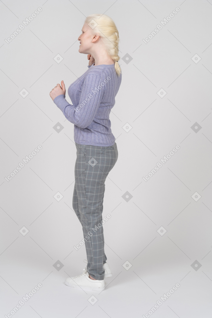 Girl standing with bent arms