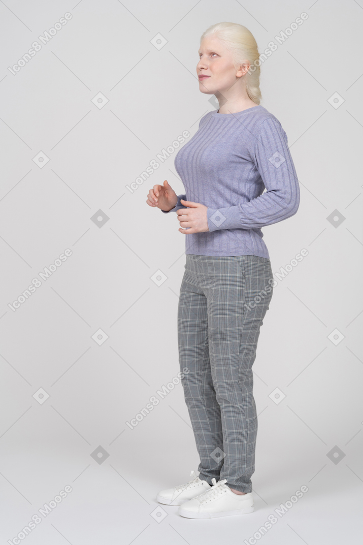 Young woman moving her hands and looking confused