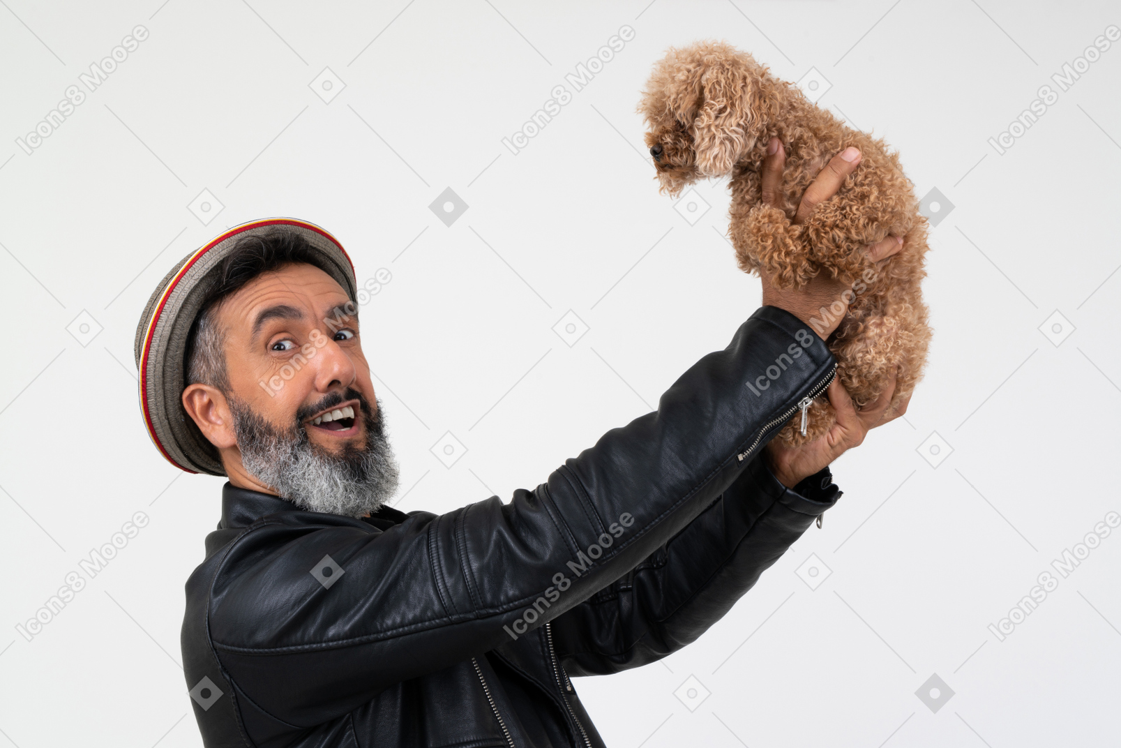 Impressed mature man holding a puppy