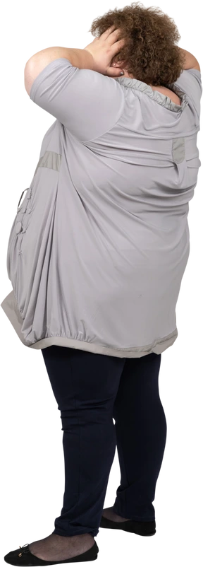 Side view of a woman touching her head