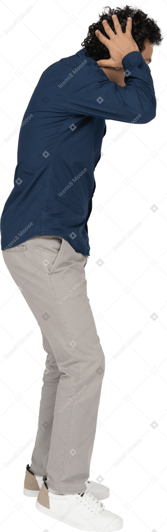 Man in casual clothes posing in profile