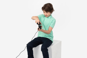 Focused boy playing video game