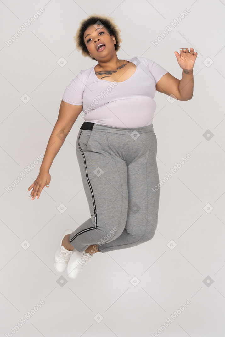 Expressive african-american female jumping up