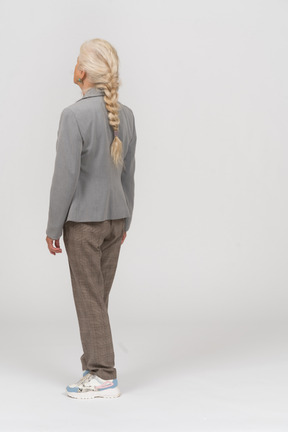 Back view of an old lady in suit