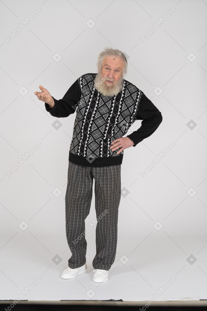 Puzzled old man outstretching hand