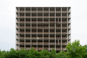 New building under construction surrounded with trees