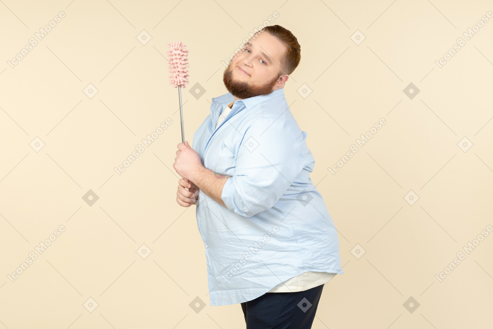 Cacthy looking young overweight househusband holding pipe-cleaner