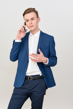 Handsome young man talking on the phone