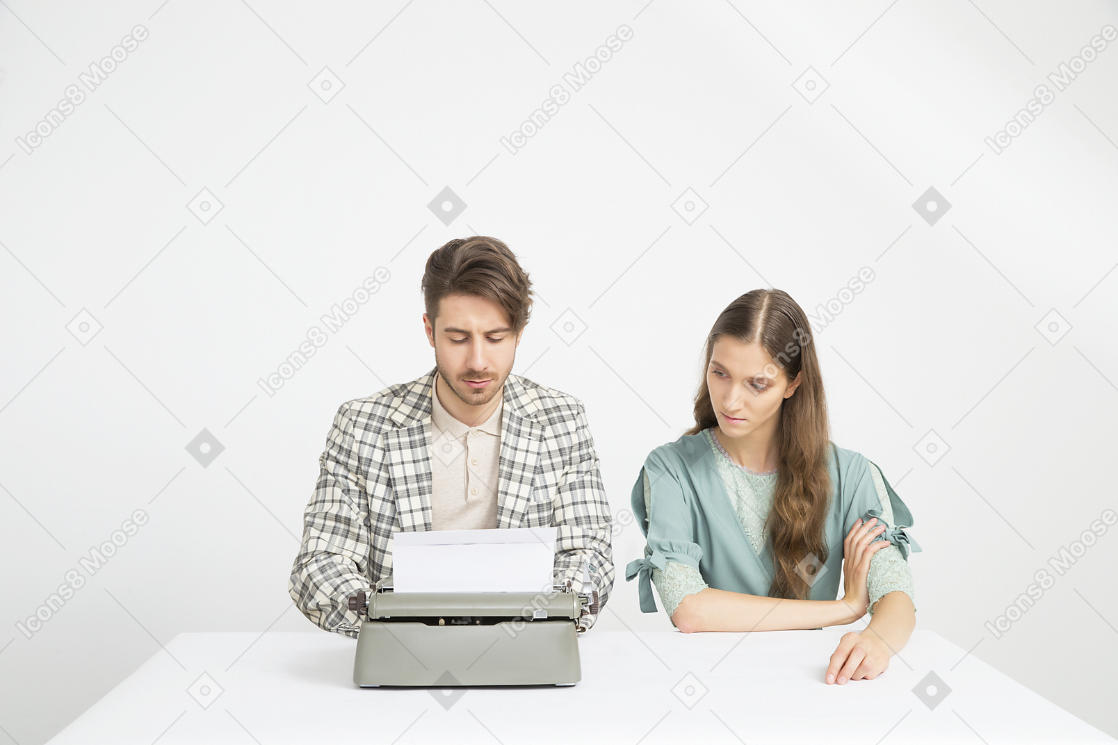 Couple sitting  at the table and working on the novel