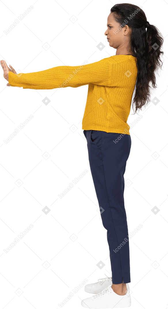 Side view of a girl in casual clothes showing stop gesture