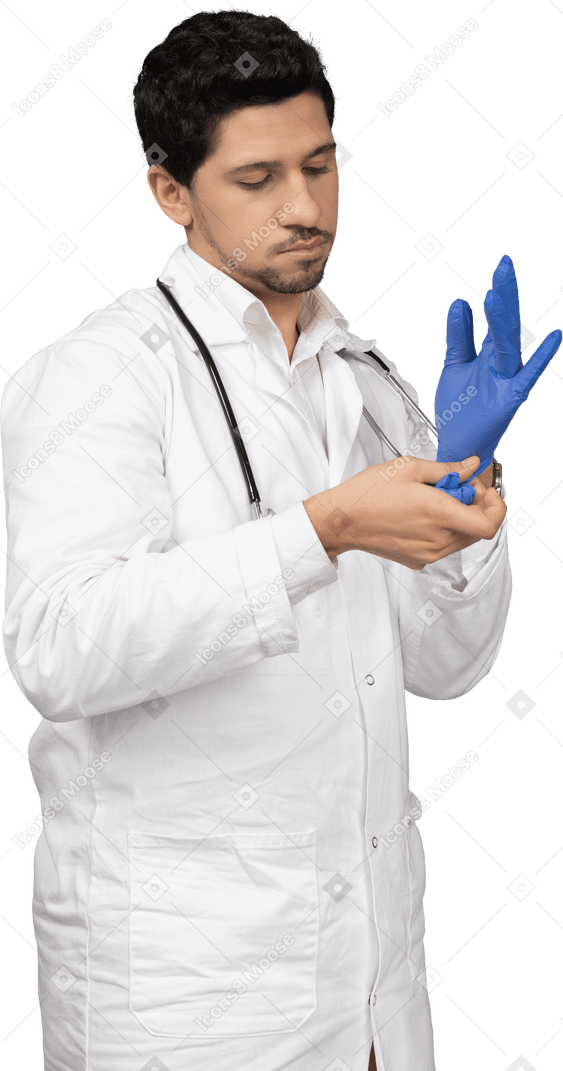 Doctor putting on blue gloves