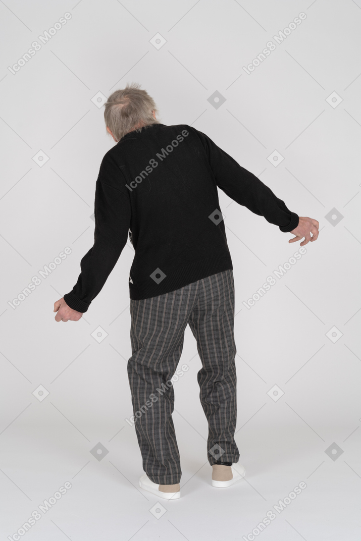 Back view of a senior man falling back