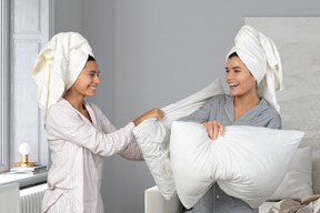 Pillow fight between two women