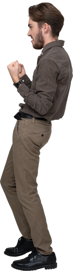 Side view of a delighted young man in office clothing