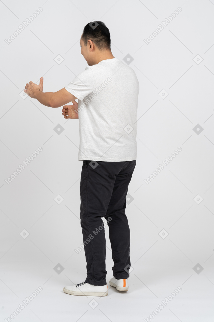 Man in casual clothes wants to hug someone