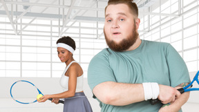 A man and a woman holding tennis rackets