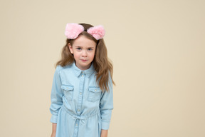 Cute little girl looking from under her eyebrows