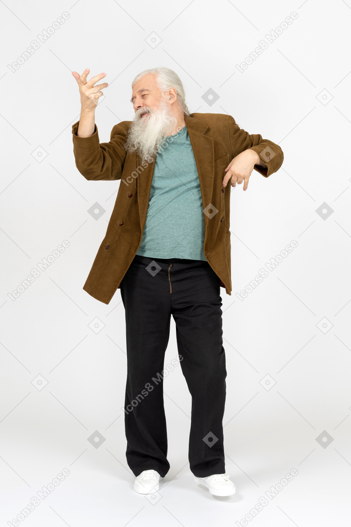 Portrait of an old man dancing cheerfully