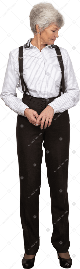 Front view of an old lady in office clothing looking aside