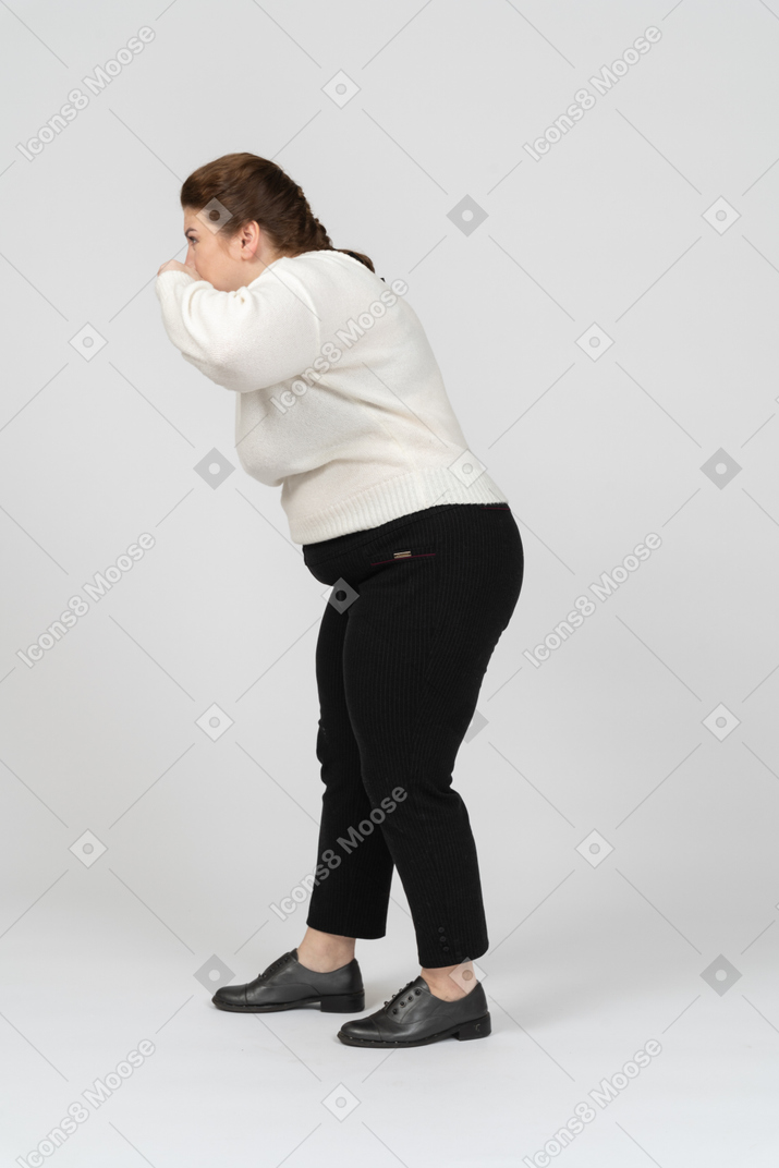 Plus size woman in casual clothes making faces