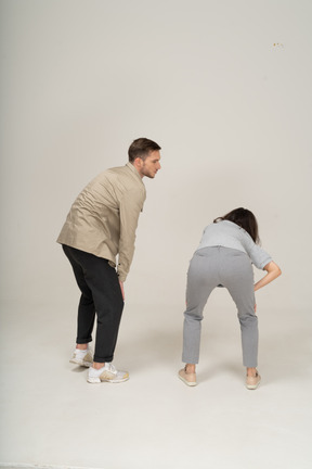 Back view of exhausted young man and woman