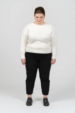 Plump woman in casual clothes standing