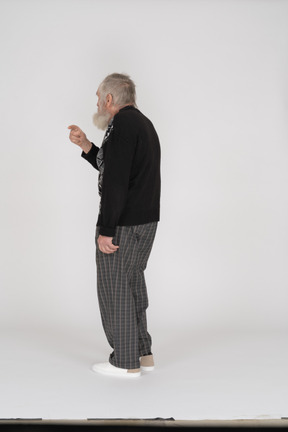 Back view of old man with raised arm