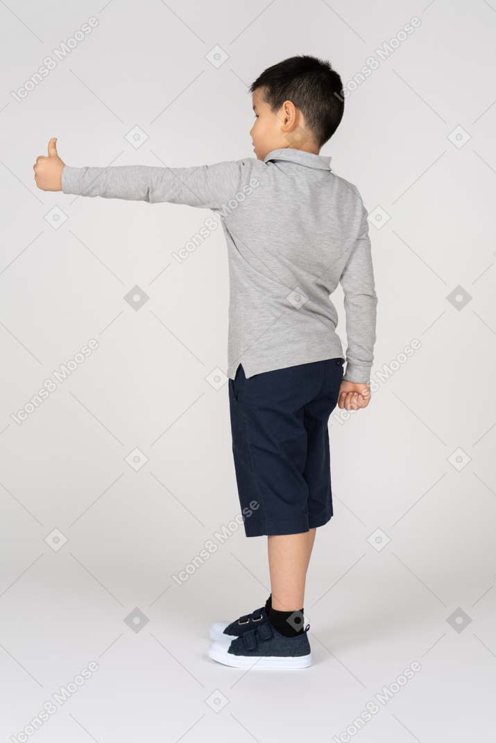 Boy giving thumb up