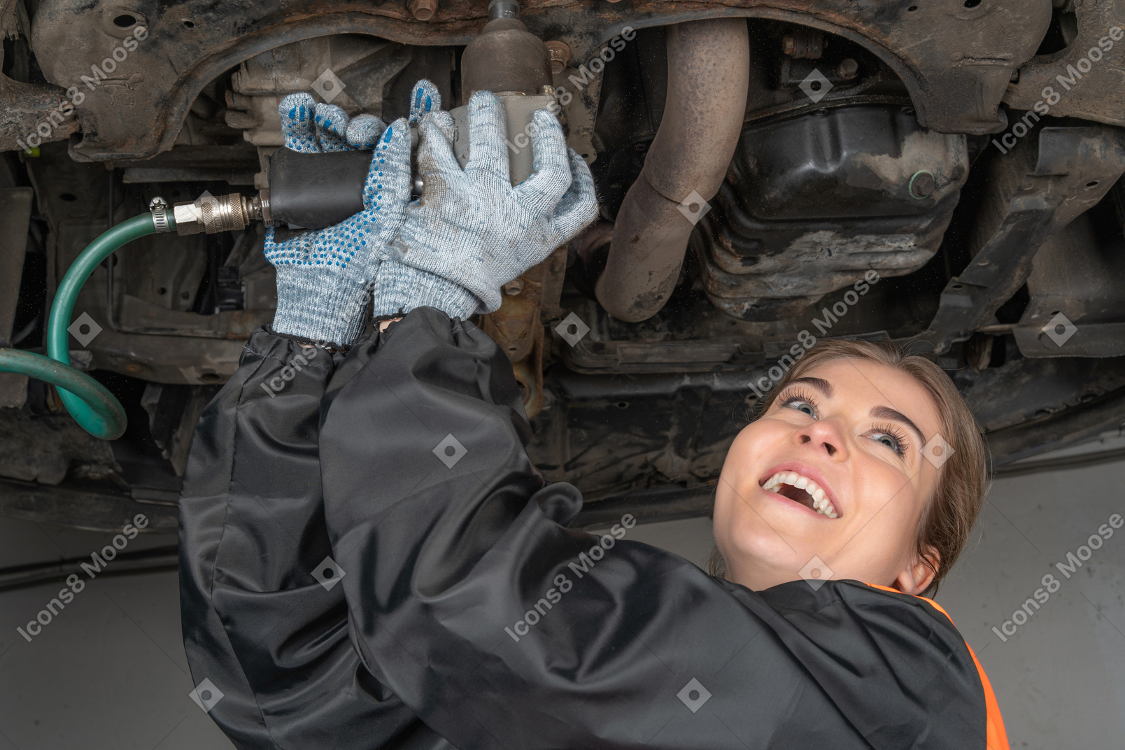 Young woman repairing car