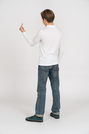 Young man in casual clothes standing