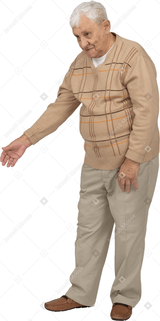 Front view of an old man in casual clothes making welcoming gesture