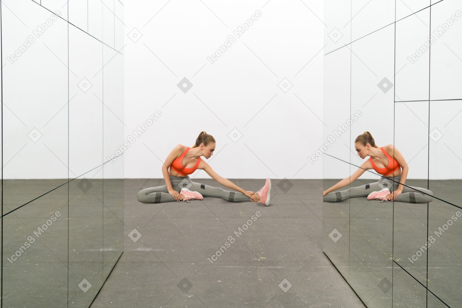 Sporty young woman doing exercises at the gym